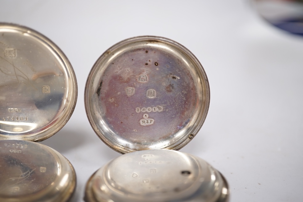 Three early to mid 20th century silver open faced pocket watches, with Roman or Arabic dials and subsidiary seconds, including two keyless and one key wind (Admiral Tacy Watch Co), together with one smaller silver open f